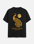 ARTELVIO Festive Light Tee in black with a golden peacock and full moon graphic.