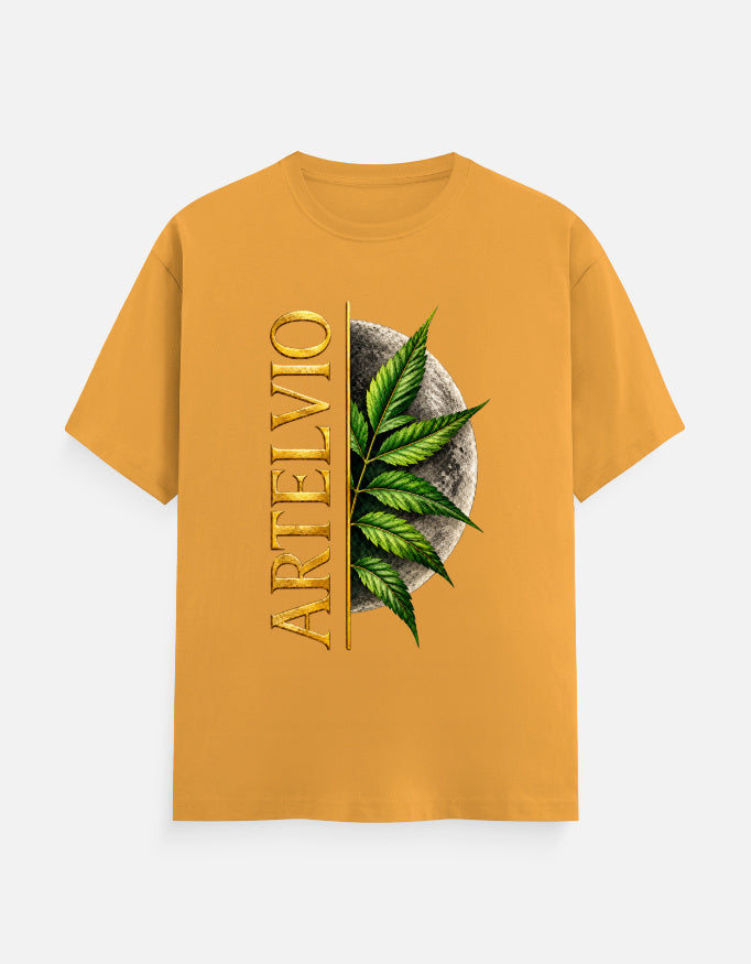 ARTELVIO Lunar Botanica Tee in golden yellow with green botanical leaves, full moon graphic, and vertical ARTELVIO typography