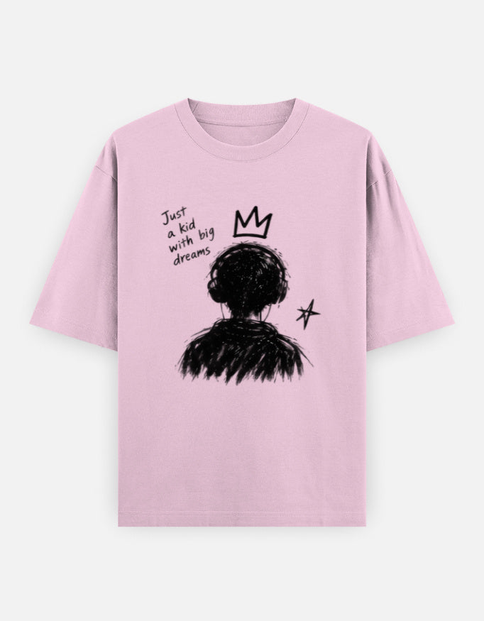 Pink oversized t-shirt with a hand-drawn child graphic, crown, star and "Just a kid with big dreams" text