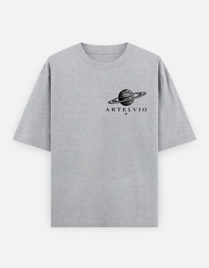 Grey oversized t-shirt featuring the ARTELVIO ringed planet graphic on the chest