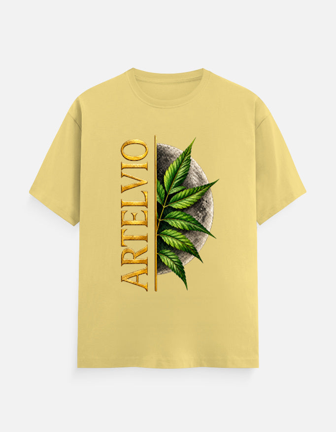 ARTELVIO Lunar Botanica Tee in yellow with green botanical leaves, full moon graphic, and vertical ARTELVIO typography