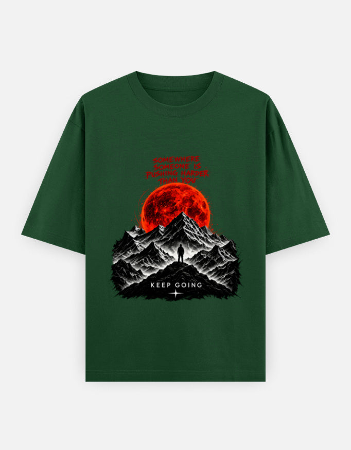 Artelvio KEEP GOING oversized t-shirt in green with red moon graphic