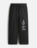 ARTELVIO black sweatpants with white celestial graphic and vertical ARTELVIO branding on the left leg